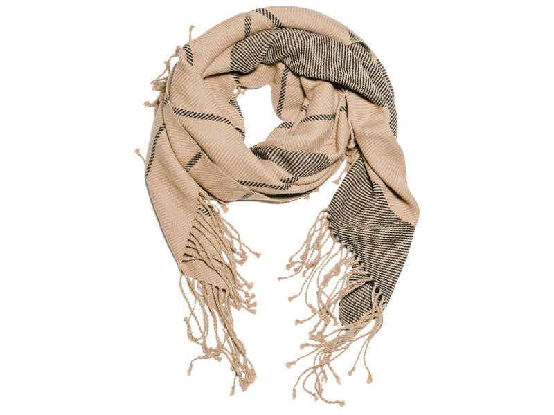 Handwoven alpaca scarf in natural beige with fine black stripes and long twisted fringe, shown looped and styled on a white background.